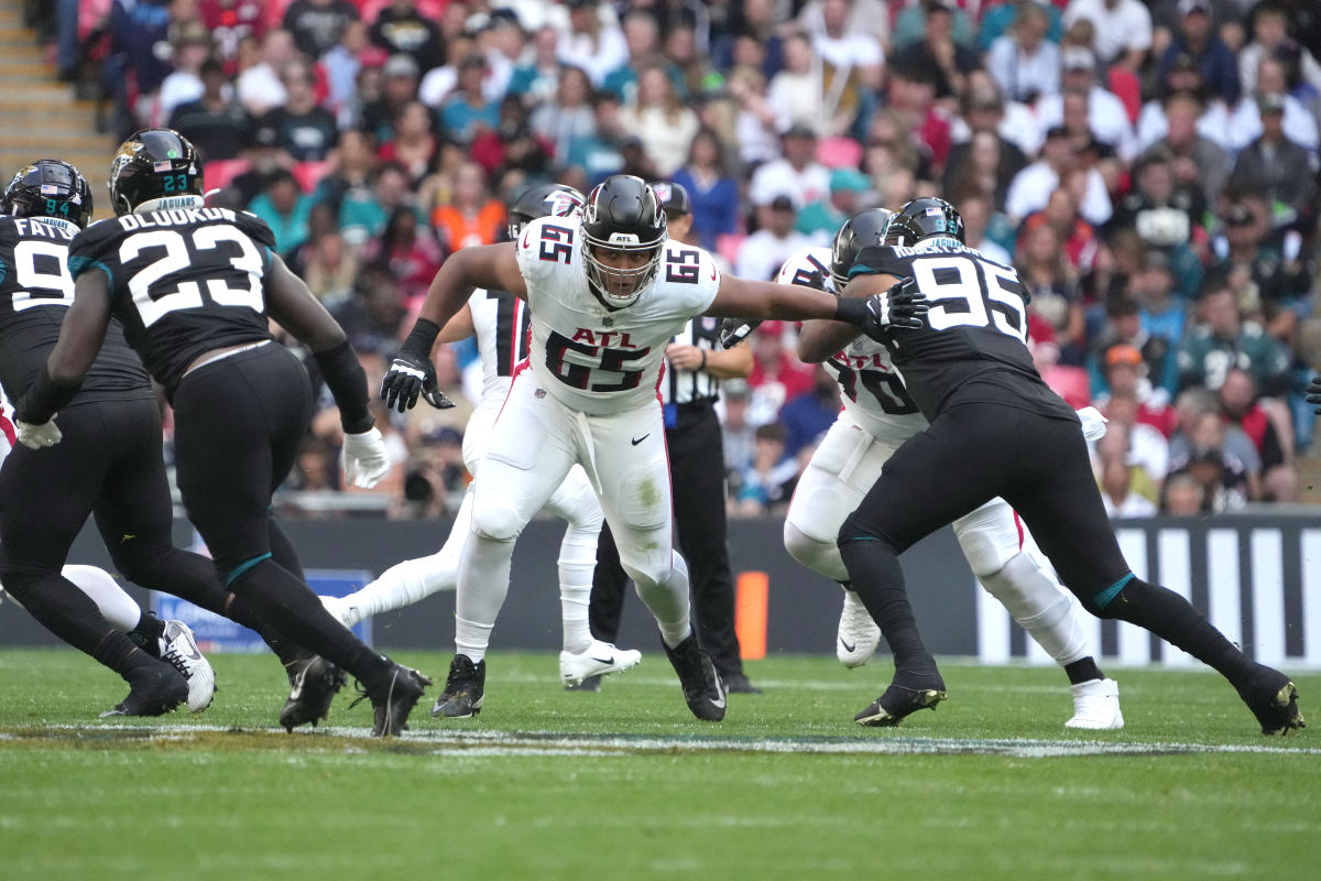 Oct 1, 2023; London, United Kingdom; Atlanta Falcons guard Matthew Bergeron (65) defends against Jacksonville Jaguars defensive end Roy Robertson-Harris (95) in the first half during an NFL International Series game at Wembley Stadium.